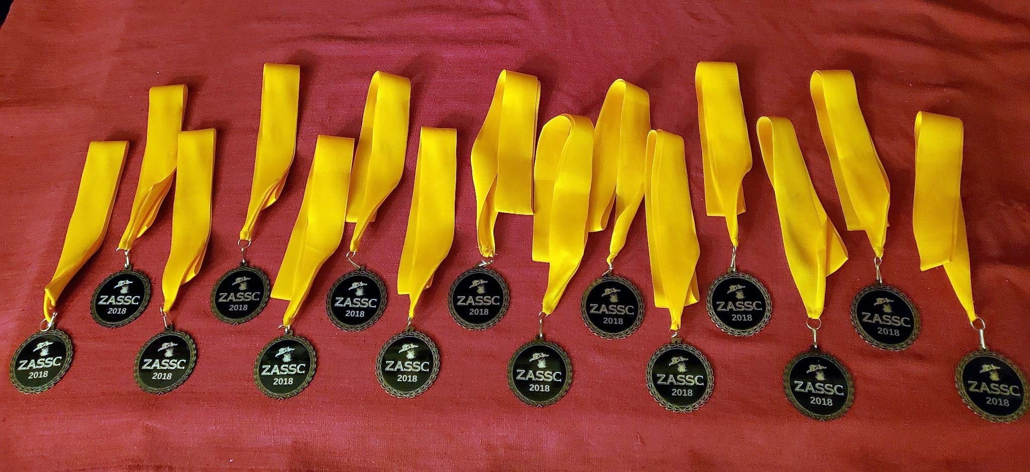 The ZASSC medallions on orange ribbons, each stamped 2018.